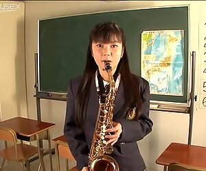 Playful student chick blows the pipe in the college room